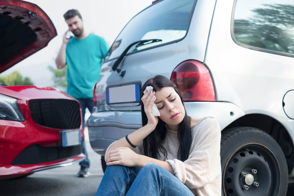 Female driver suffering head injuries from car accident.