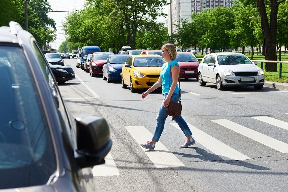 Lady crossing the street.