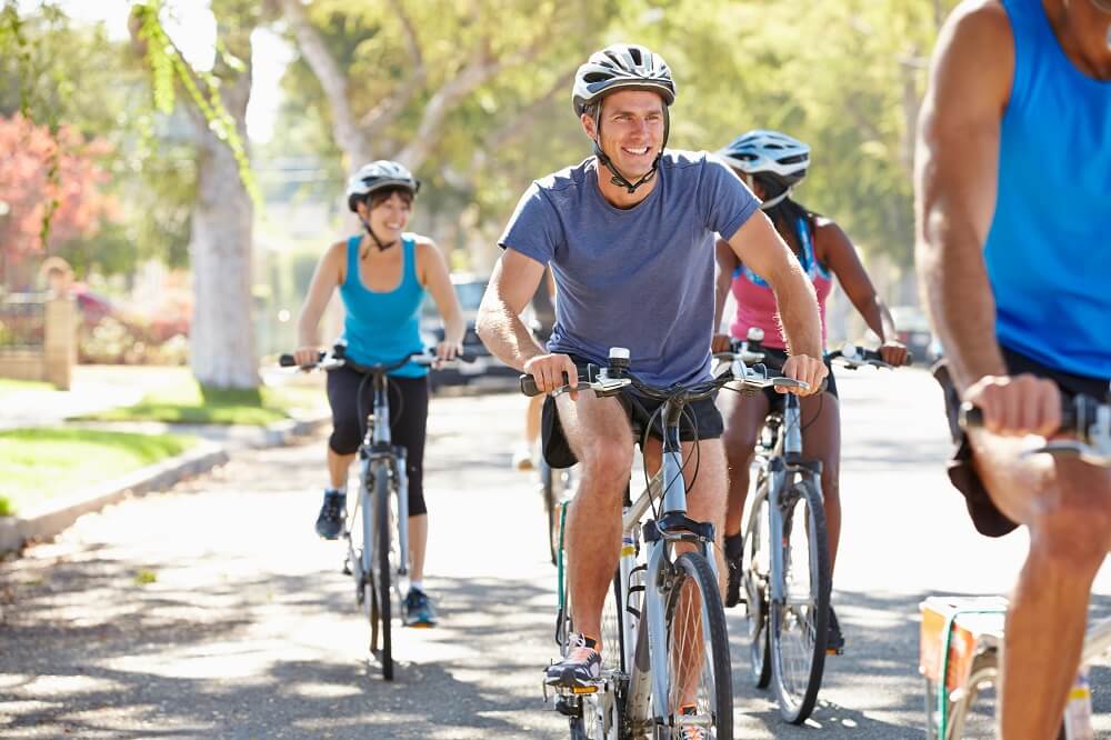 Group of cyclists in the park enjoying.